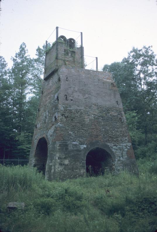 Oblique view of blast furnace, showing tapping and air blast arches, blast air…