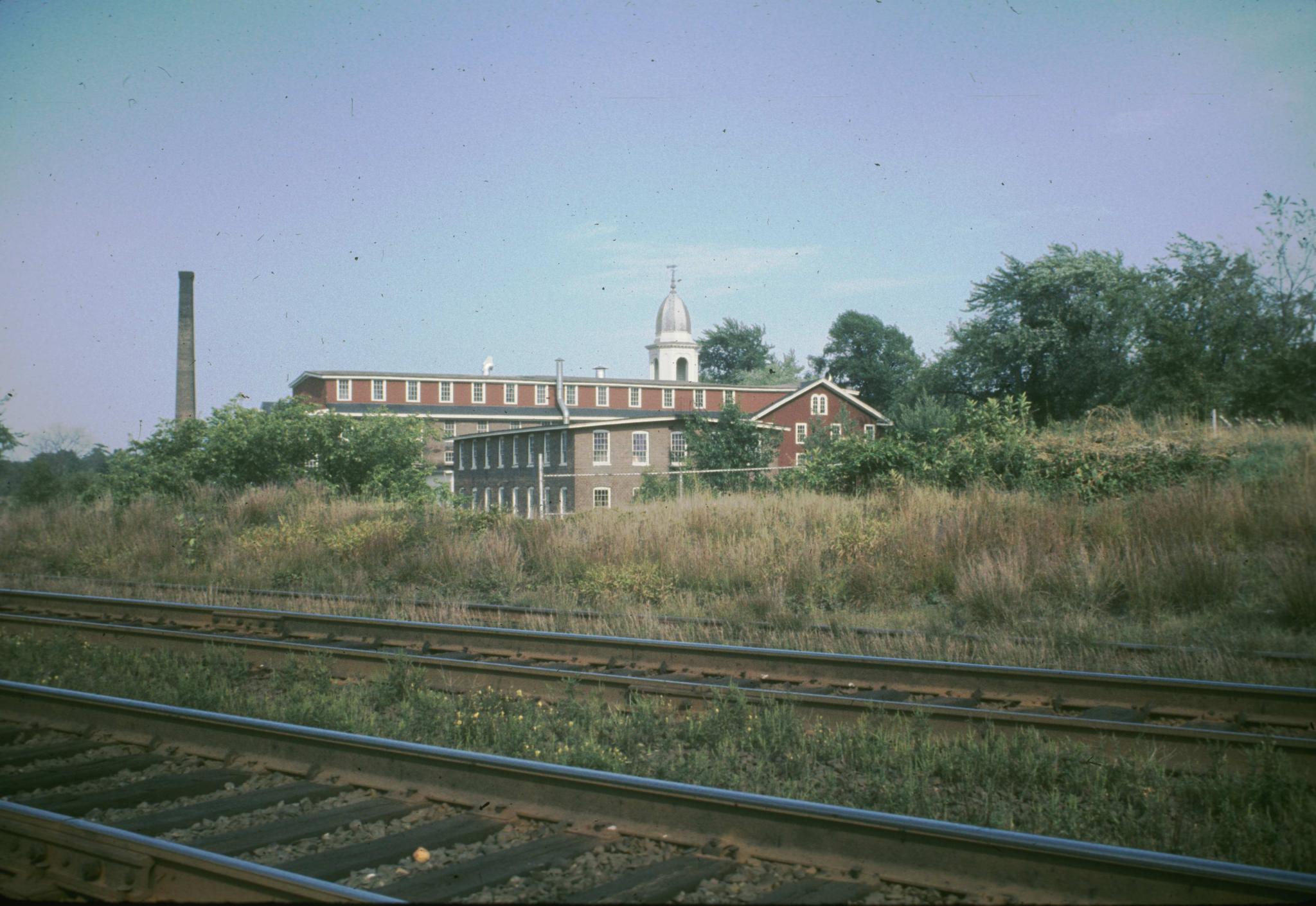 Photograph of the mill from the railroad tracks.