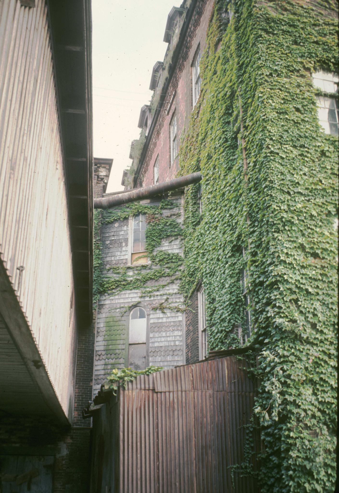 Photograph of the juncture of two mill buildings.