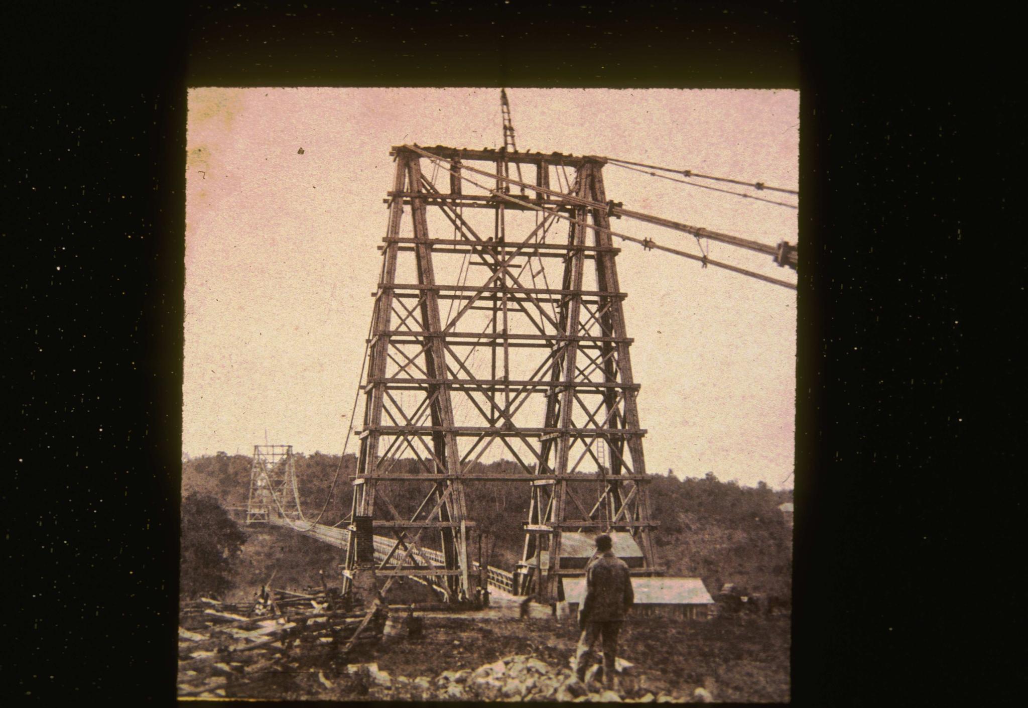 Historic photograph of the First Falls View suspension bridge circa 1885.…