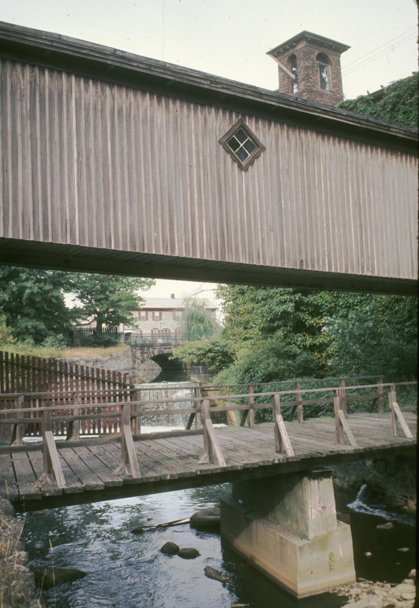 Photograph of mill bridges passing over mill canal.