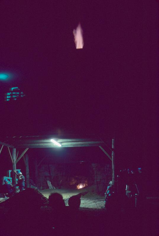 View of reconstructed furnace in blast at night. Flames are visible at the top…