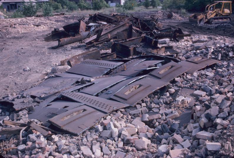 View of several large metal plates and other debris during the demolotion of…