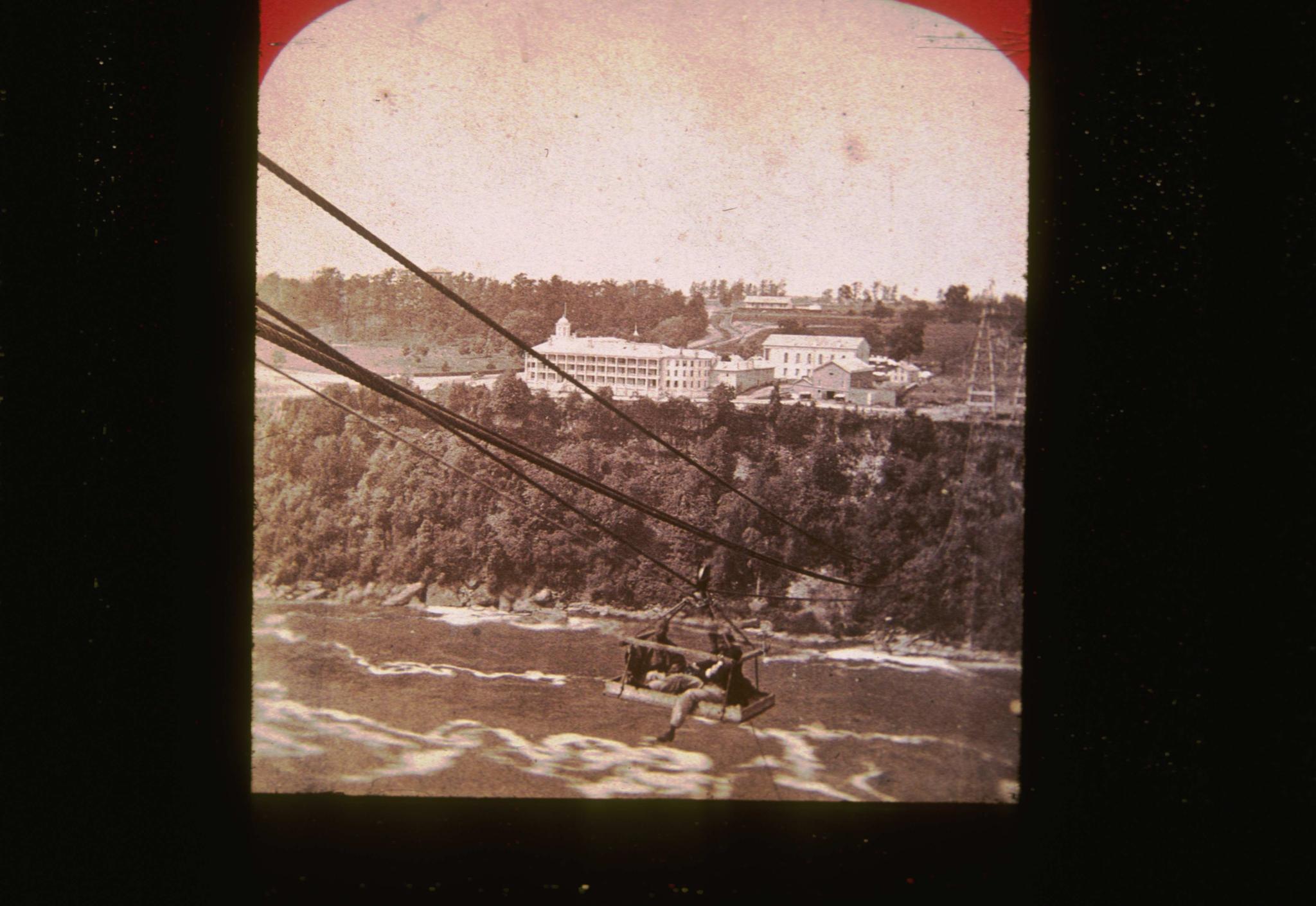 Unidentified traveler at Niagara Falls in the 1800s.  Two men are riding the…