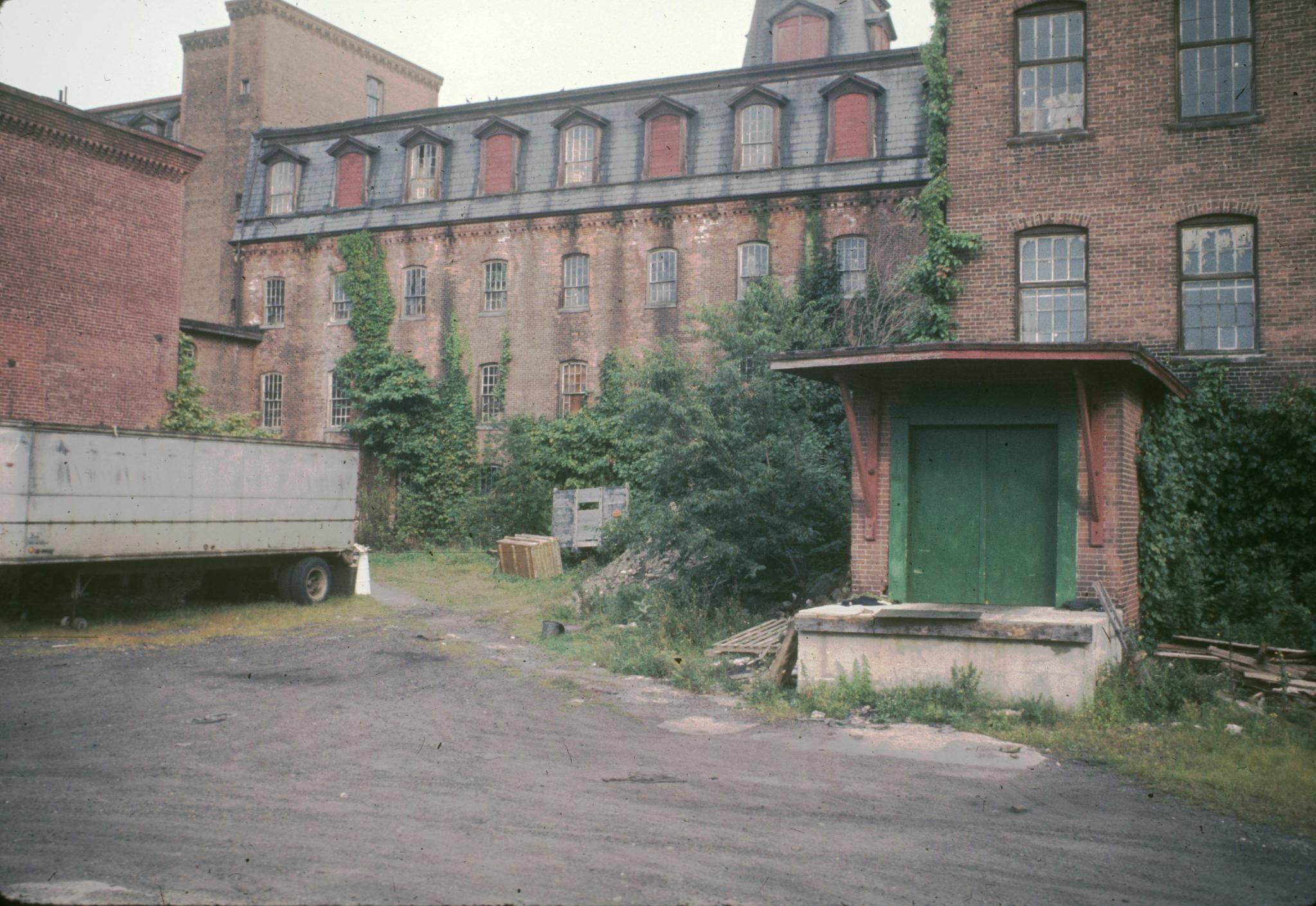 Photograph of the back of the building with a loading dock.