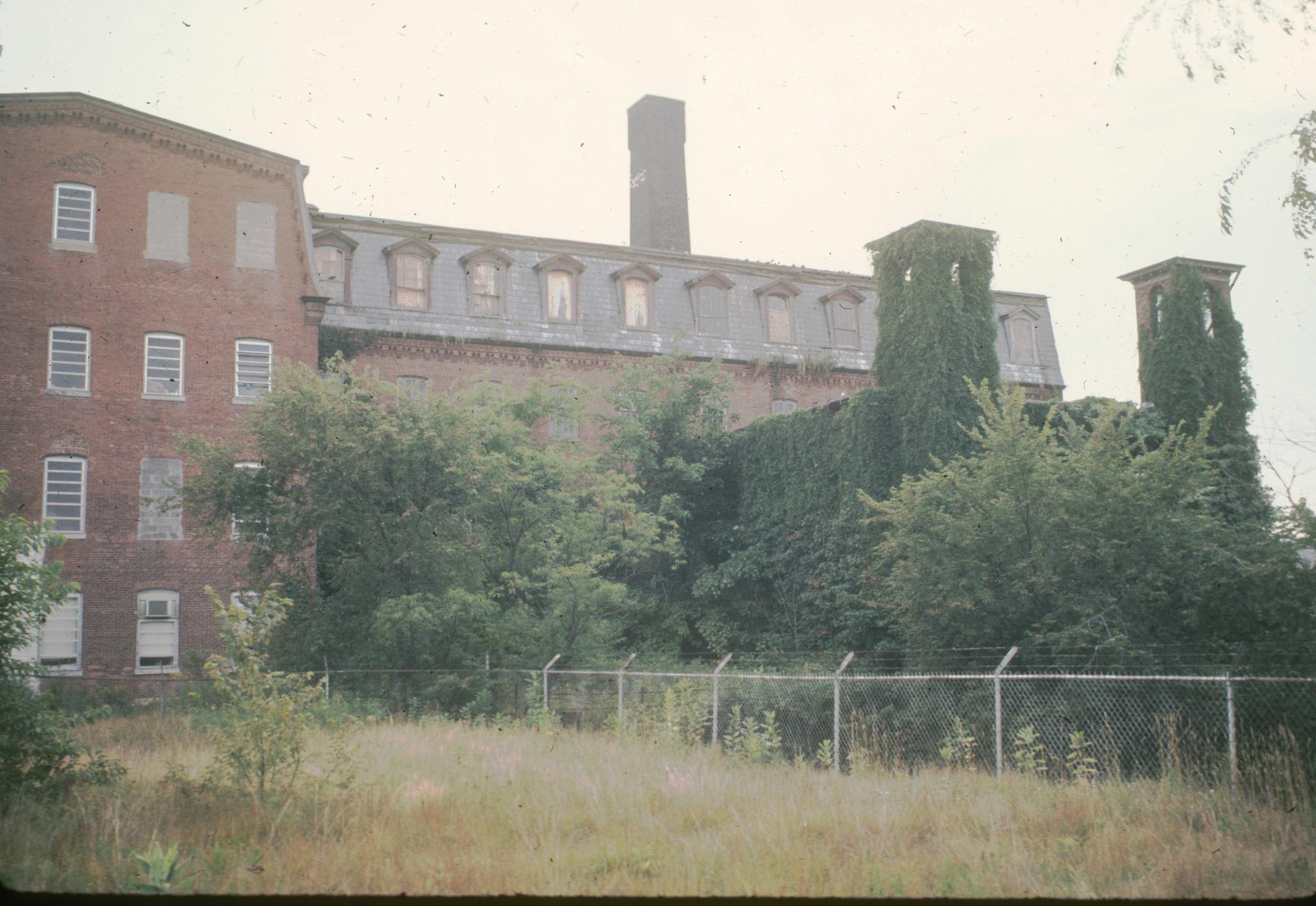 Photograph of the side of the larger mill building.