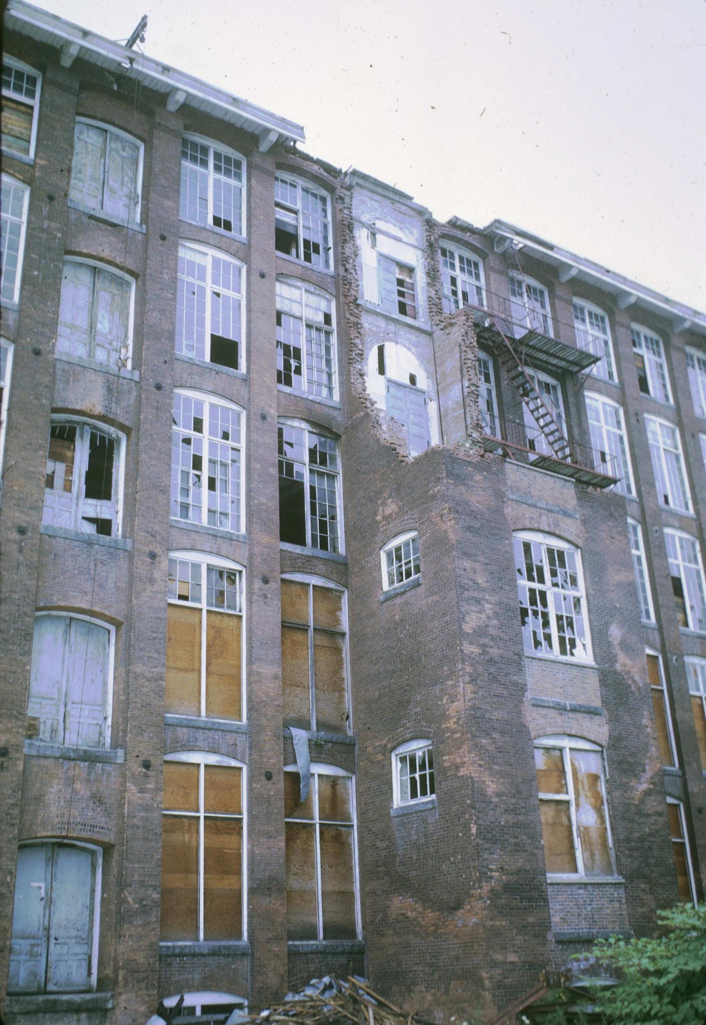 Photograph of the partially ruined mill showing the partially collapsed tower.