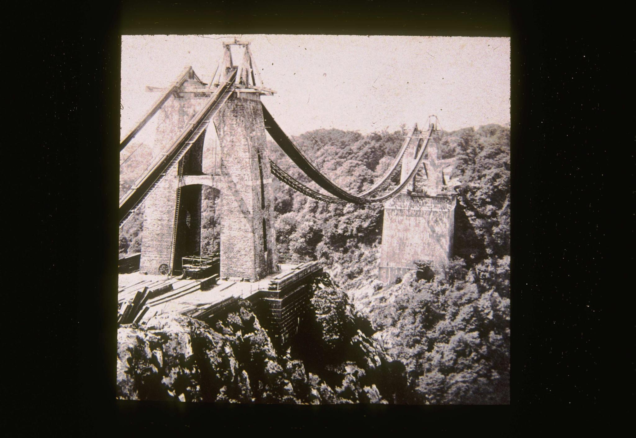 Historic photograph of the Clifton bridge under construction circa 1859.  The…