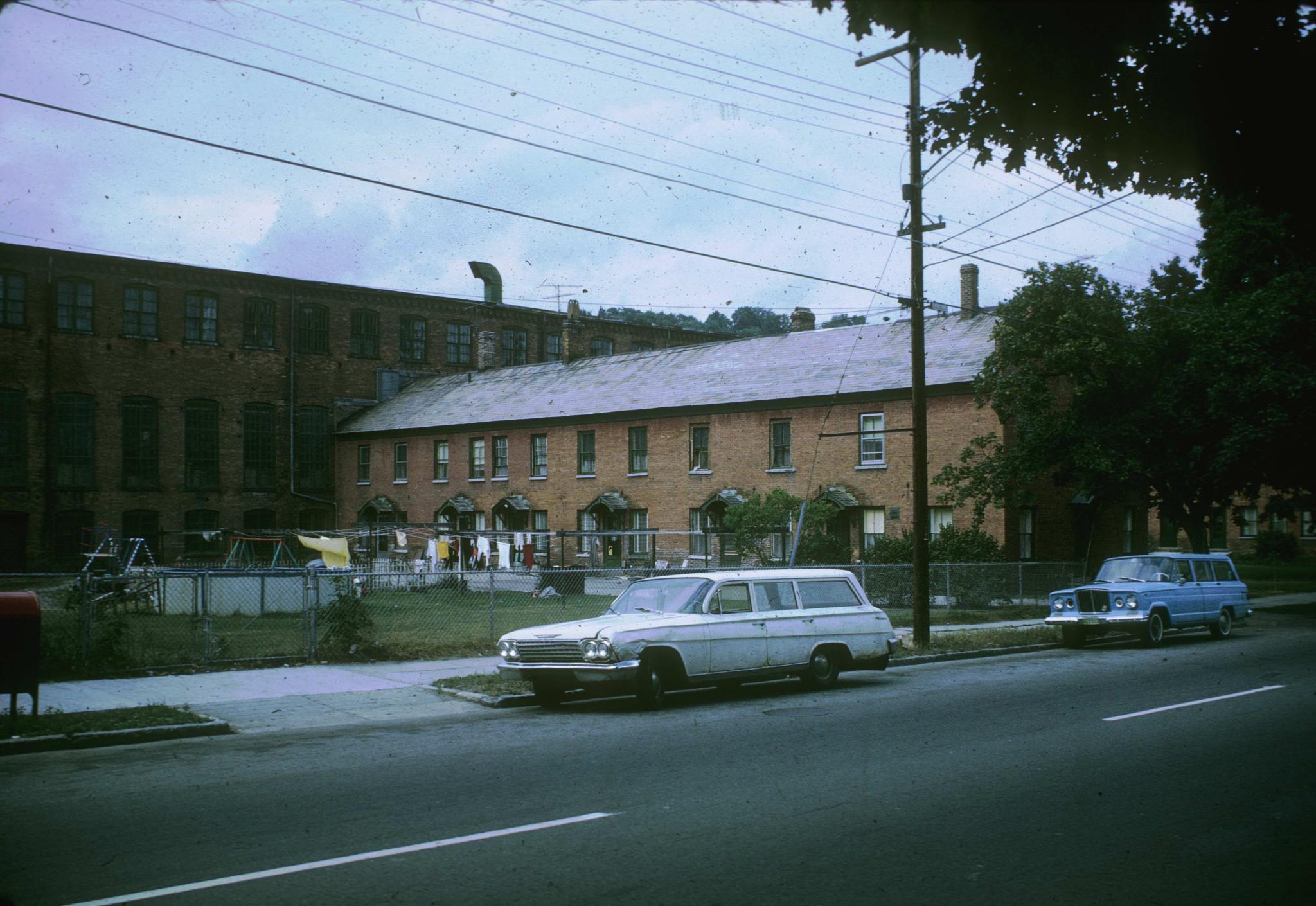 Photograph of a mill tenement attached to an unidentified textile mill in Adams…