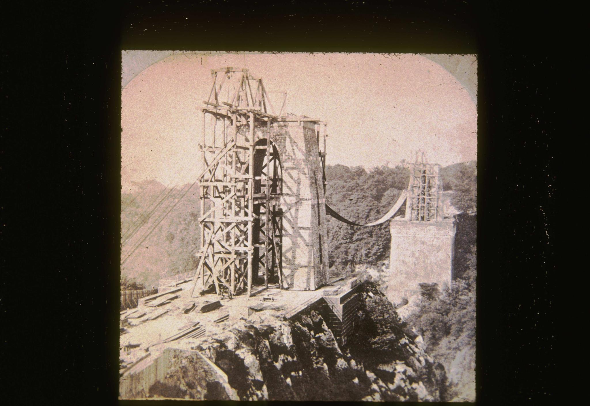 Historic photograph of the Clifton Bridge under construction.  The photograph…