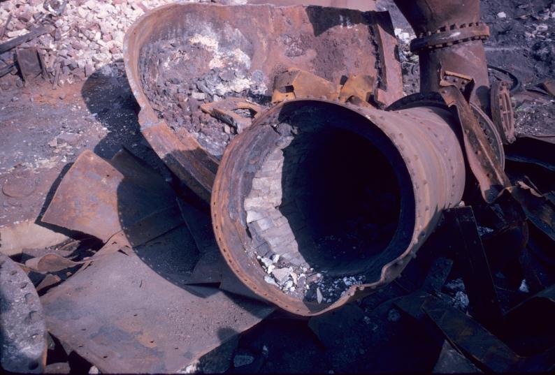 View of furnace downcomer pipe with refractory brick lining during blast…