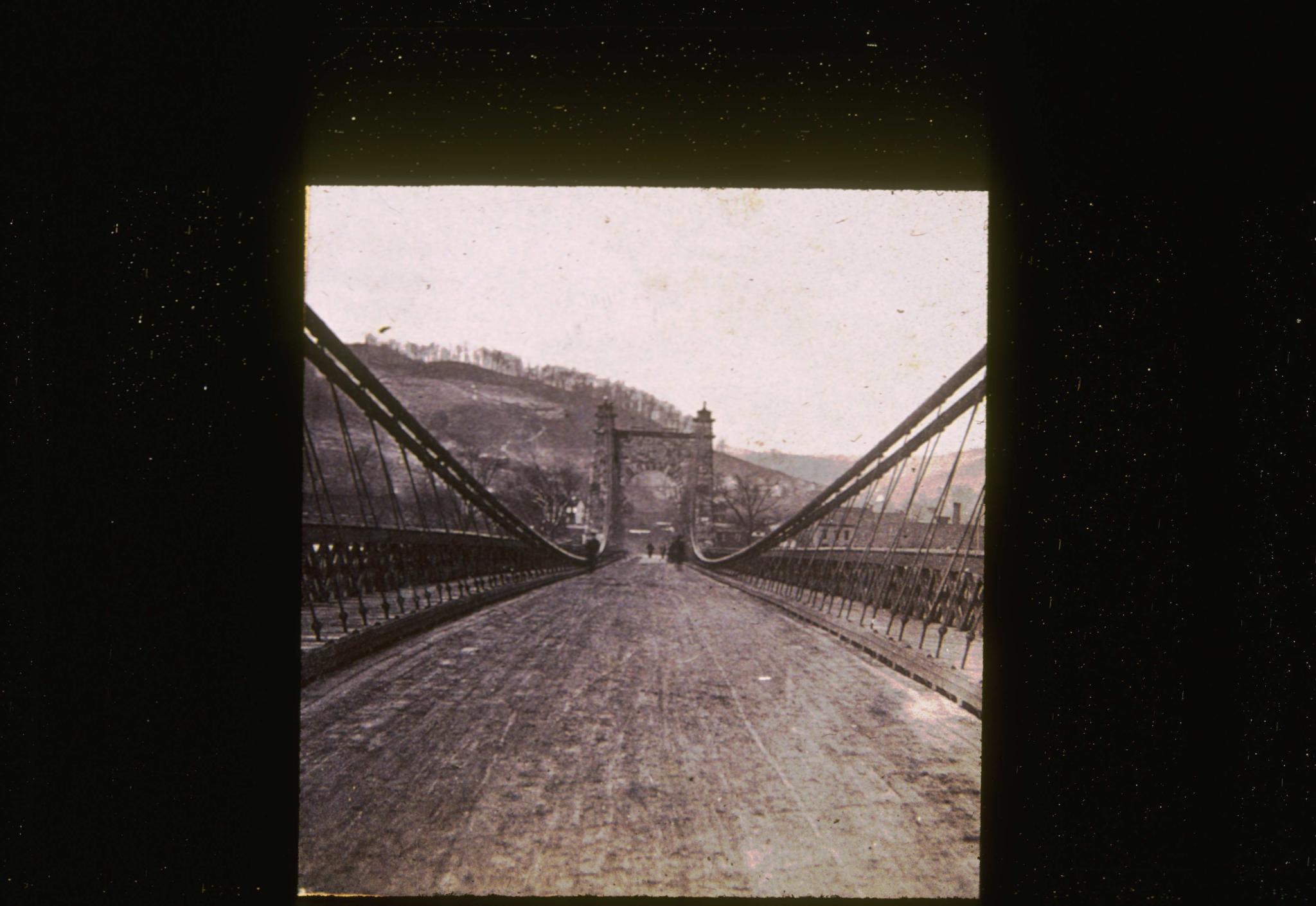 Historic photograph of the Wheeling Bridge looking along the deck.