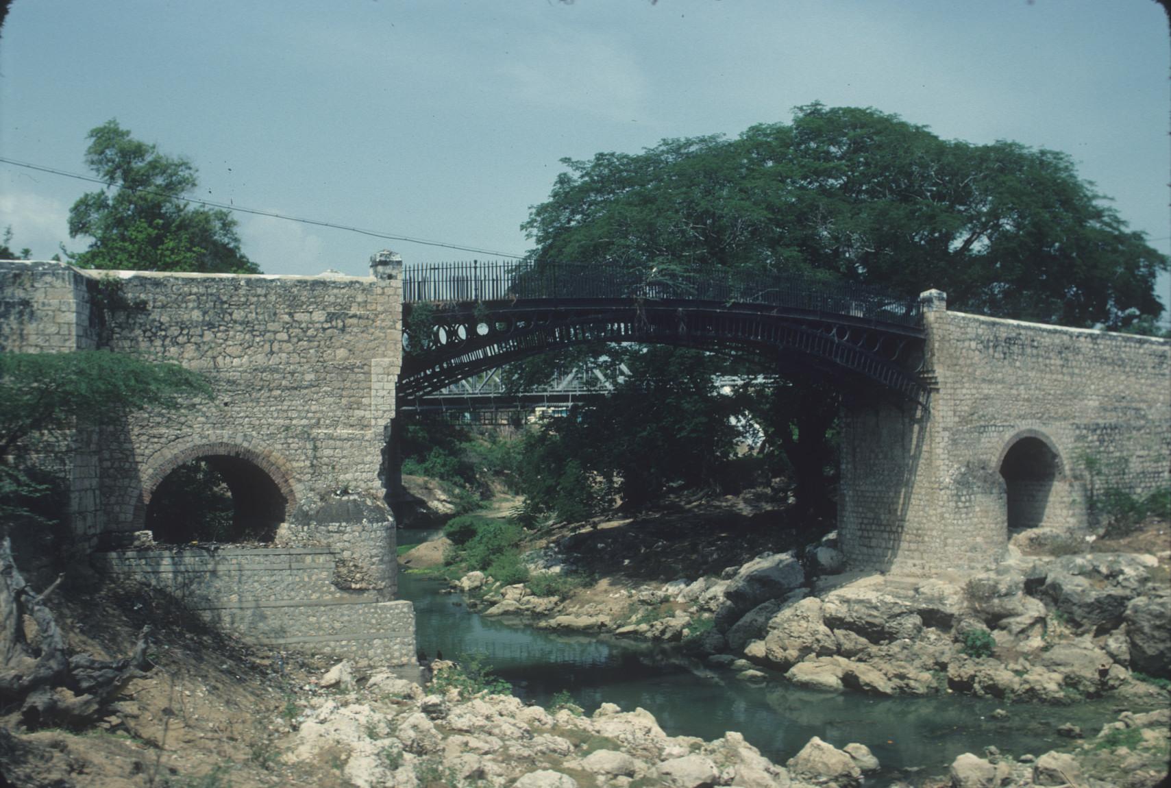 The abutment of the bridge is constructed with cut stone while the bridge is…