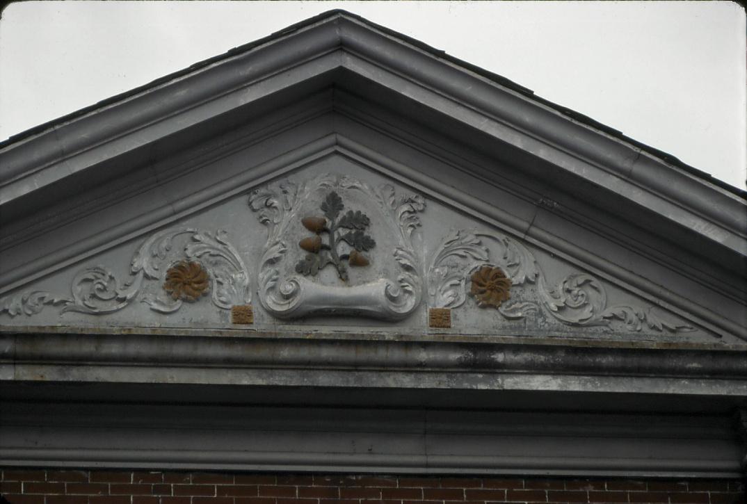 Office`s pediment with acorns and oak leaves