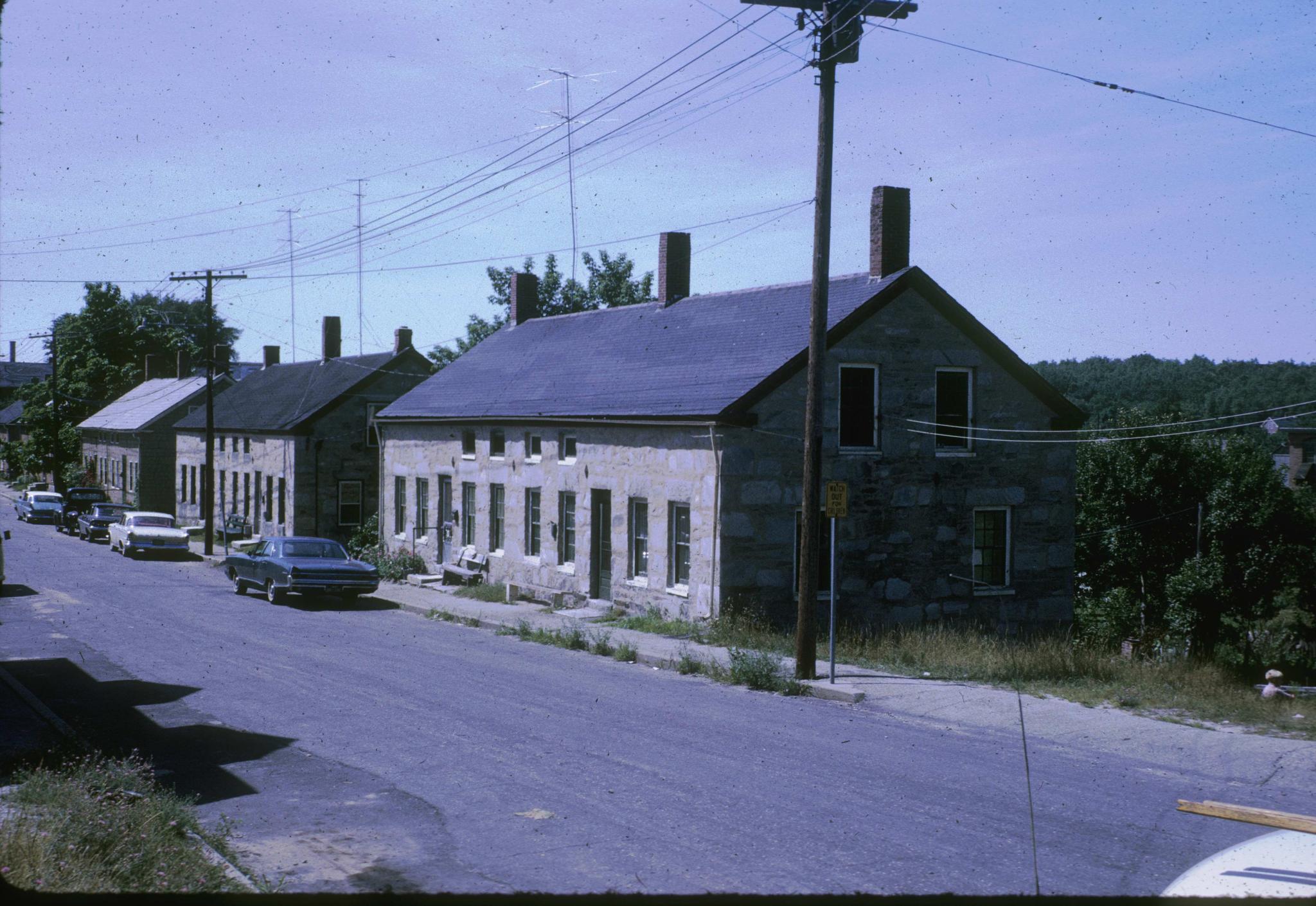 Photograph of stone workers housing associated with Slater's mills in…