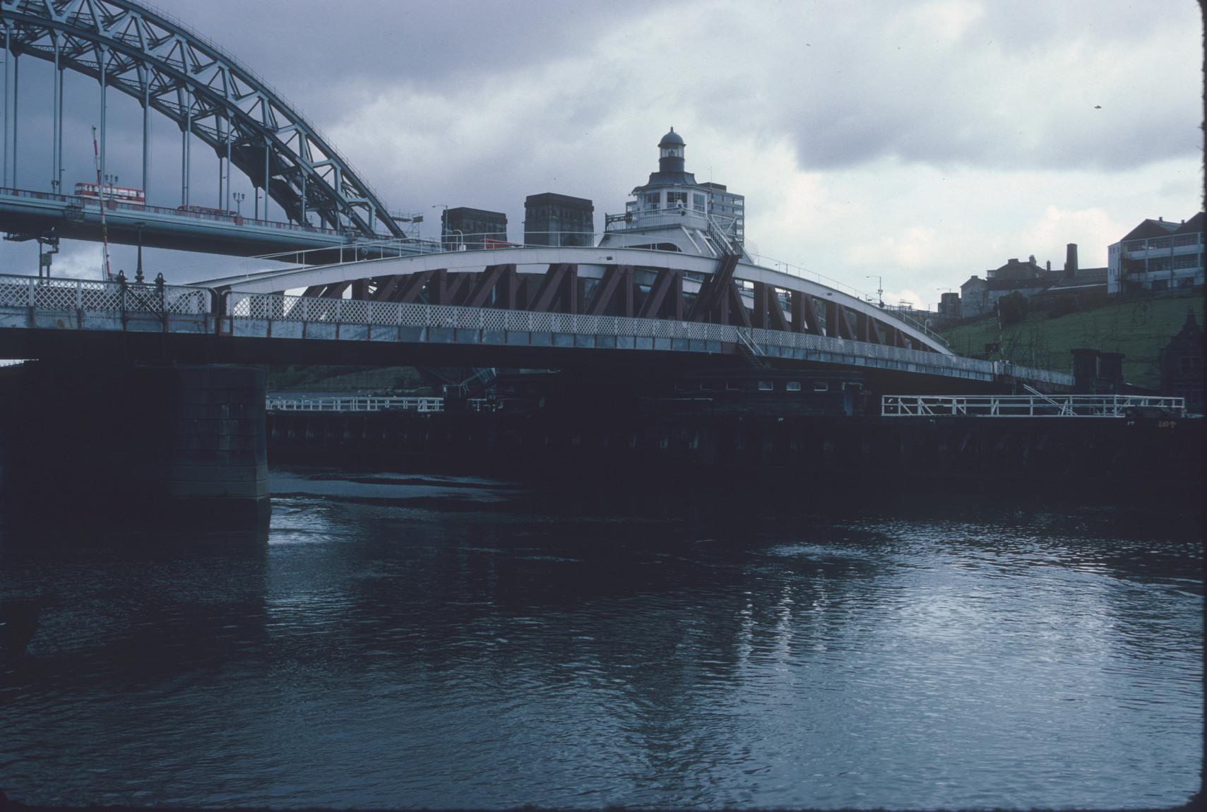 Swing Bridge crossing the River Tyne in Newcastle-upon-Tyne. The Tyne Bridge is…