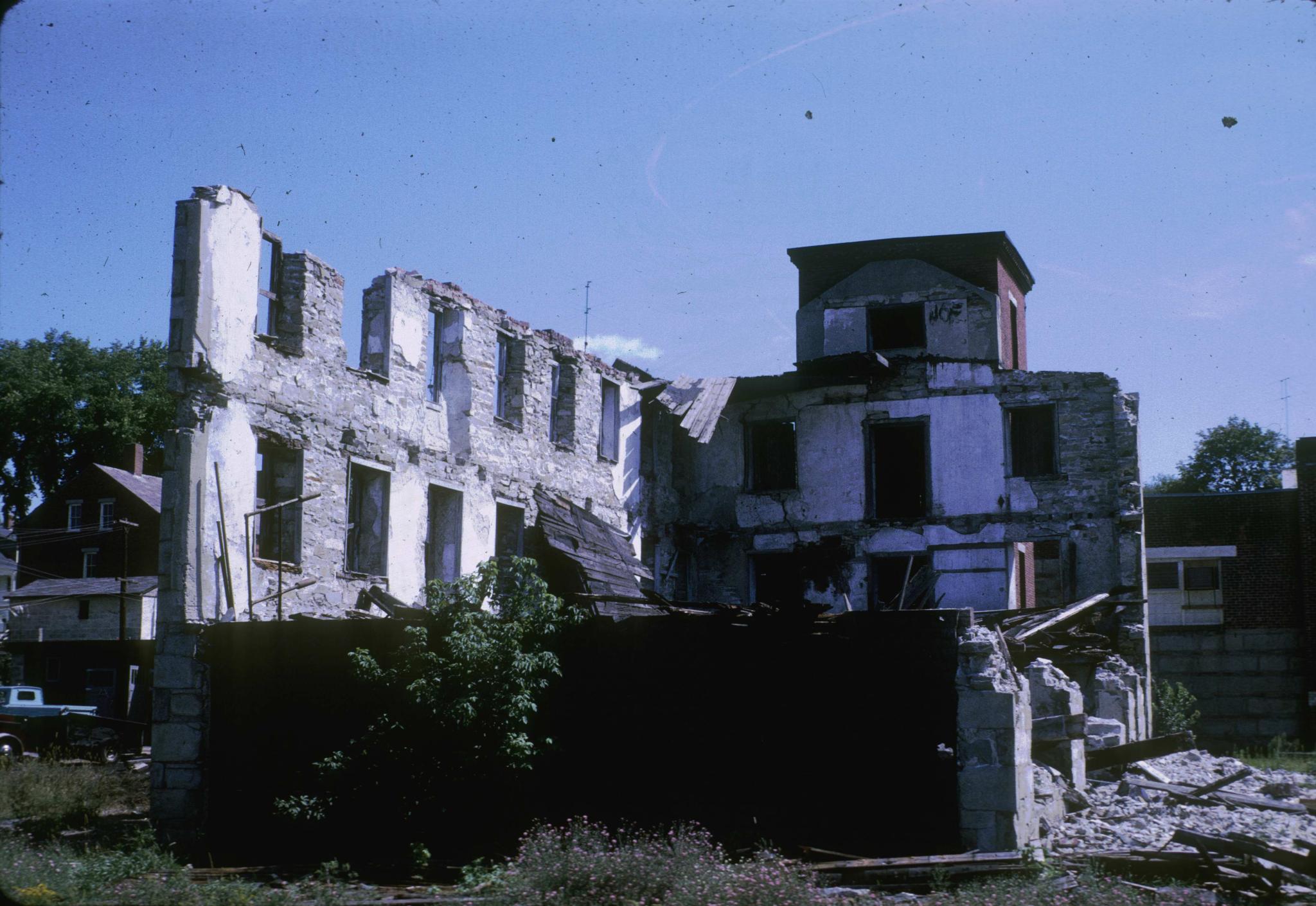 Photograph of the mill ruins showing the interior and the back of the tower.