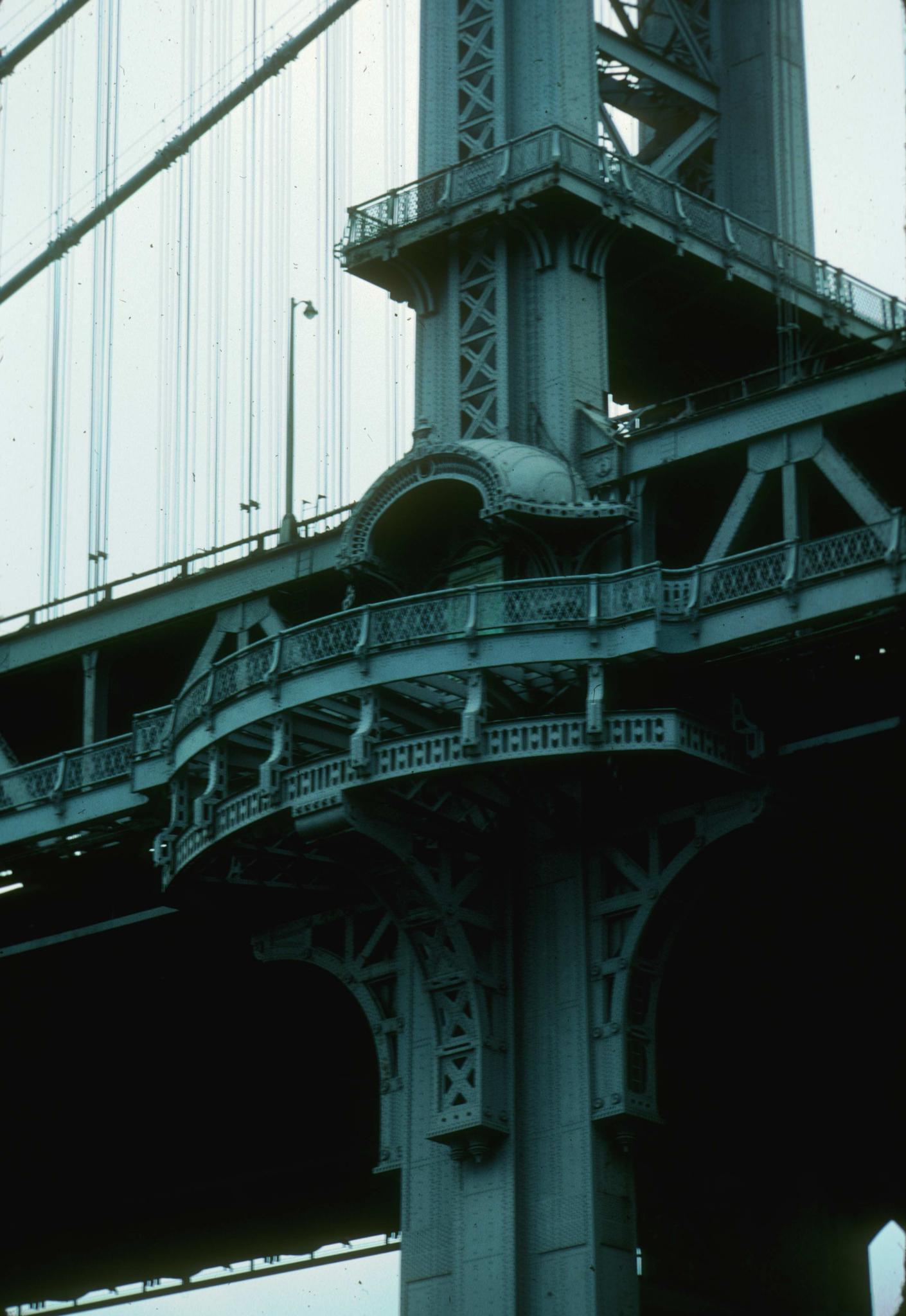 Close-up view of a tower of the Manahattan Bridge.  The photograph shows the…