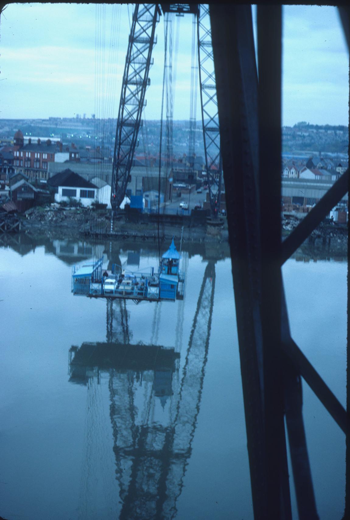 Detail of the gondola of the Newport Transporter Bridge crossing the River Usk…