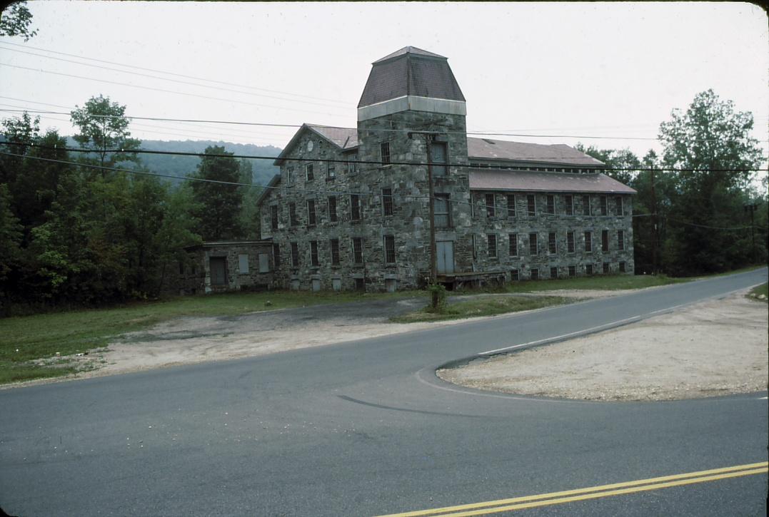 View of front of paper mill including tower.