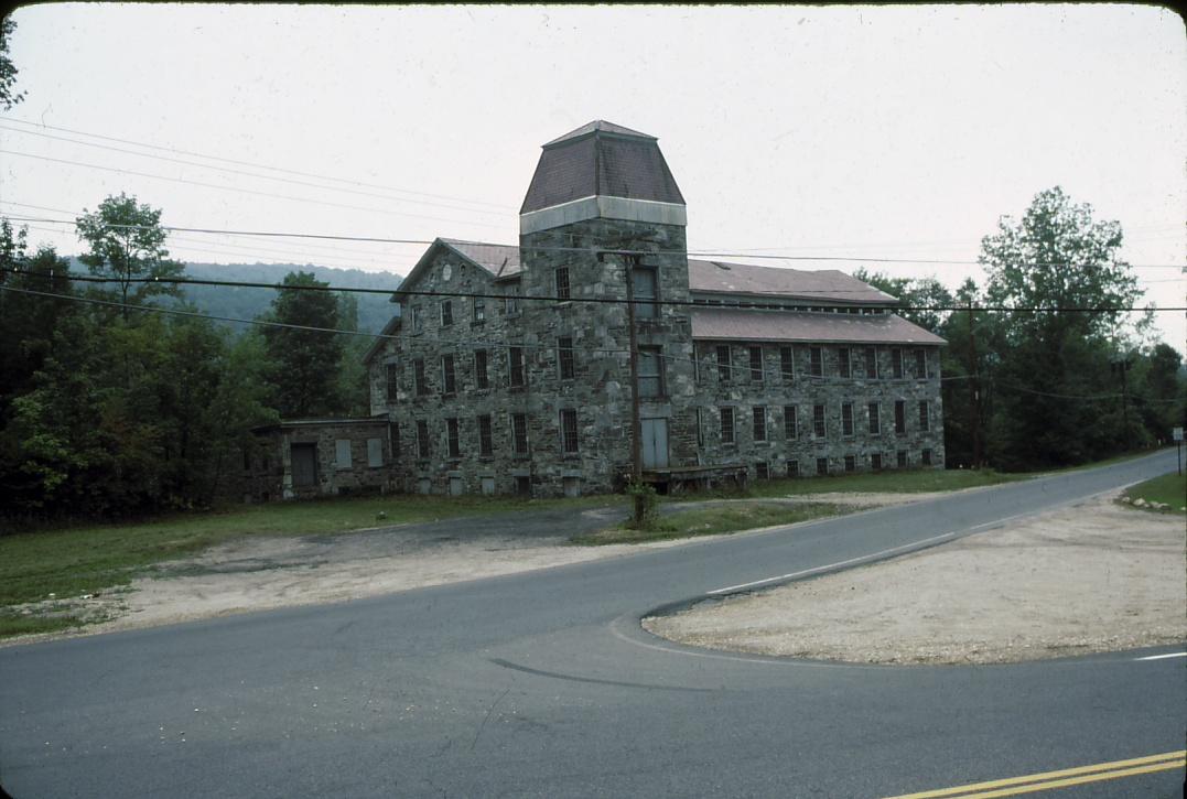 View of front of paper mill including tower.