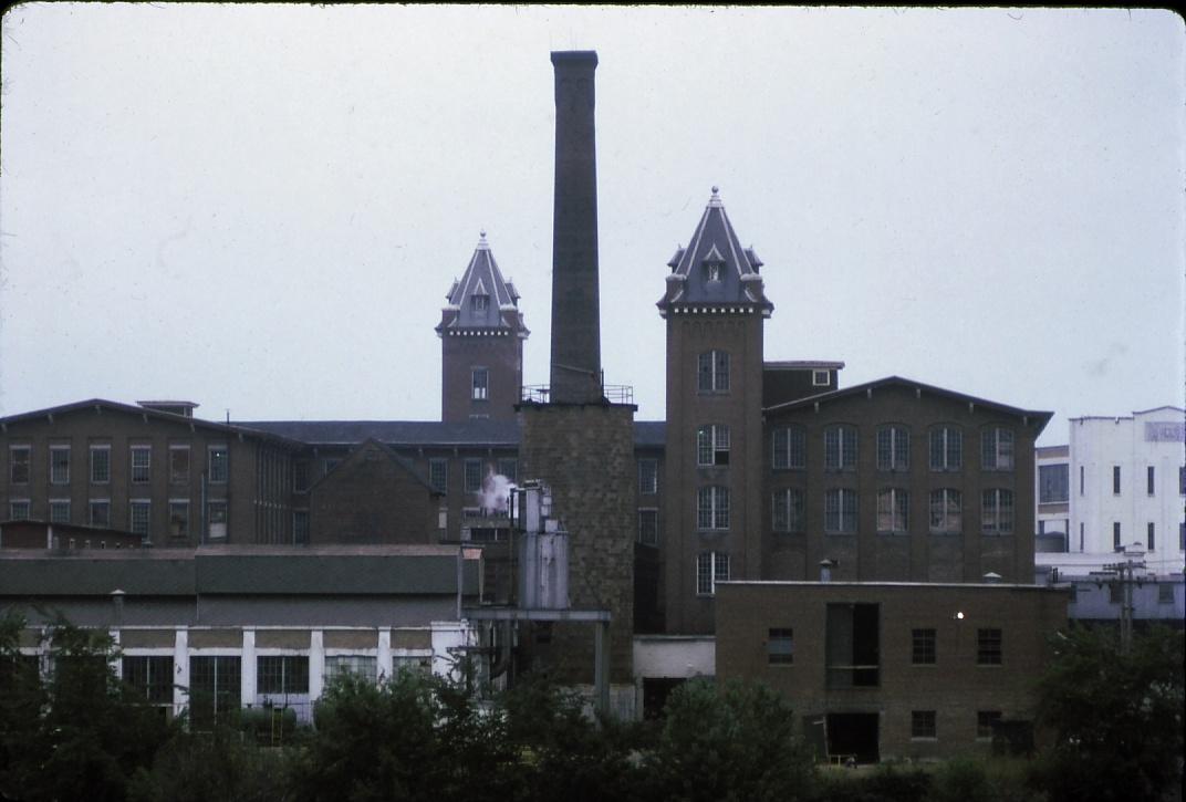 Close-up of the Worumbo Manufacturing Company's wool mill, including stack…