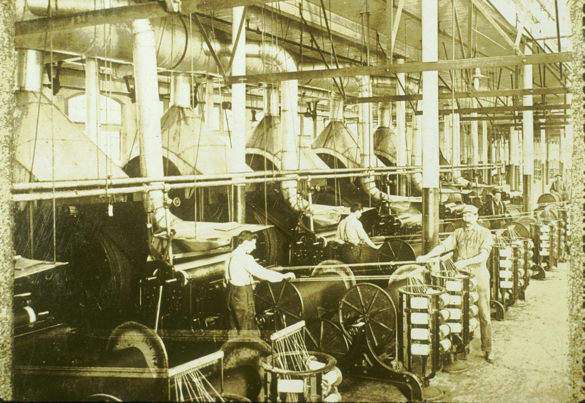 Historic photograph of an array of cotton slashers in an unidentified New…