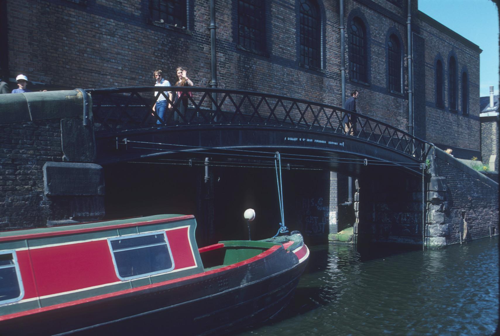 Arched cast iron bridge over the Regent\'s Canal, Camdentown, London, with…