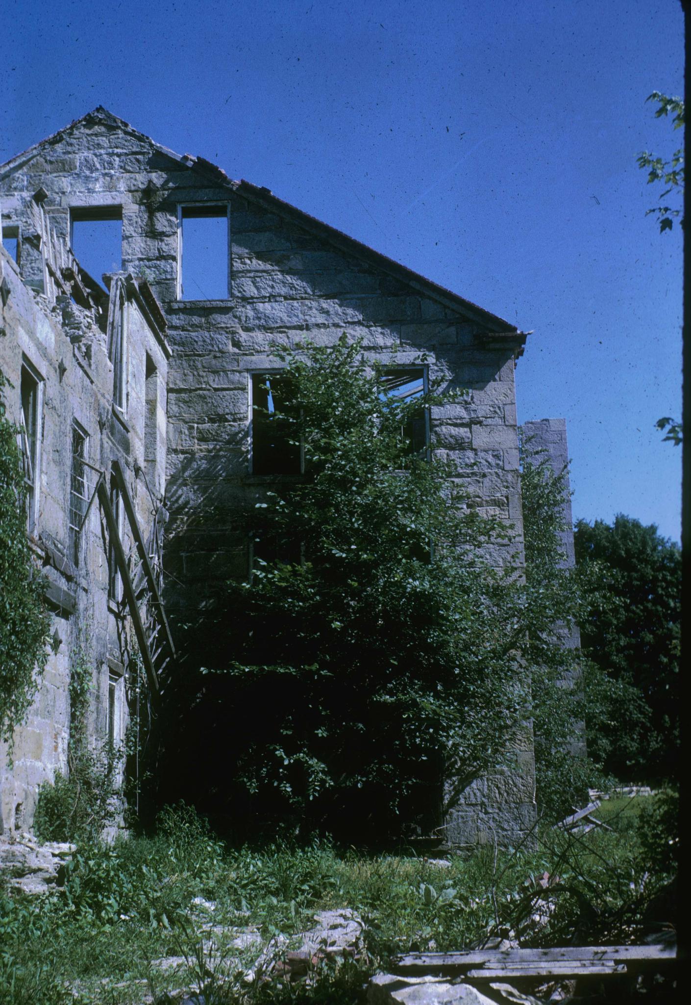 Photograph of an unidentified stone mill in Saundersville, Massachusetts.