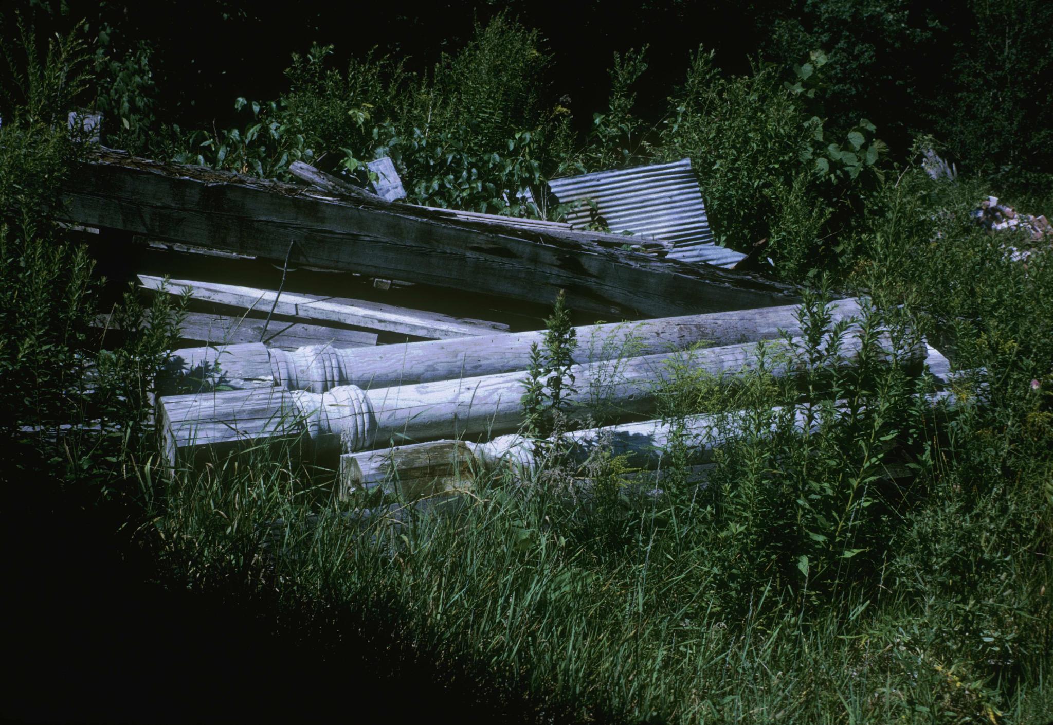 Photograph of wooden interior columns removed from an unidentified mill in…