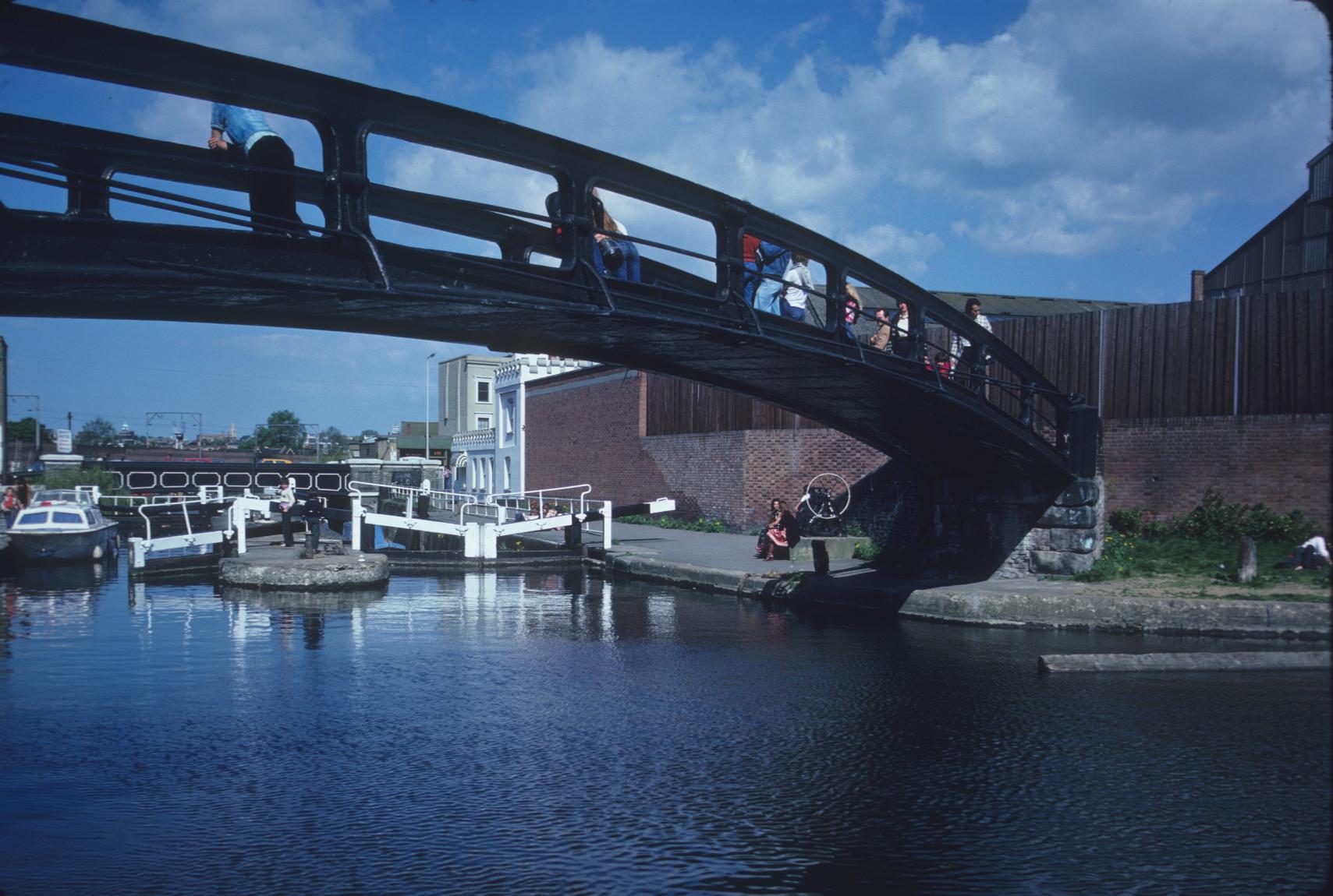 Another view of a small cast iron arch bridge over the Regent\'s Canal,…