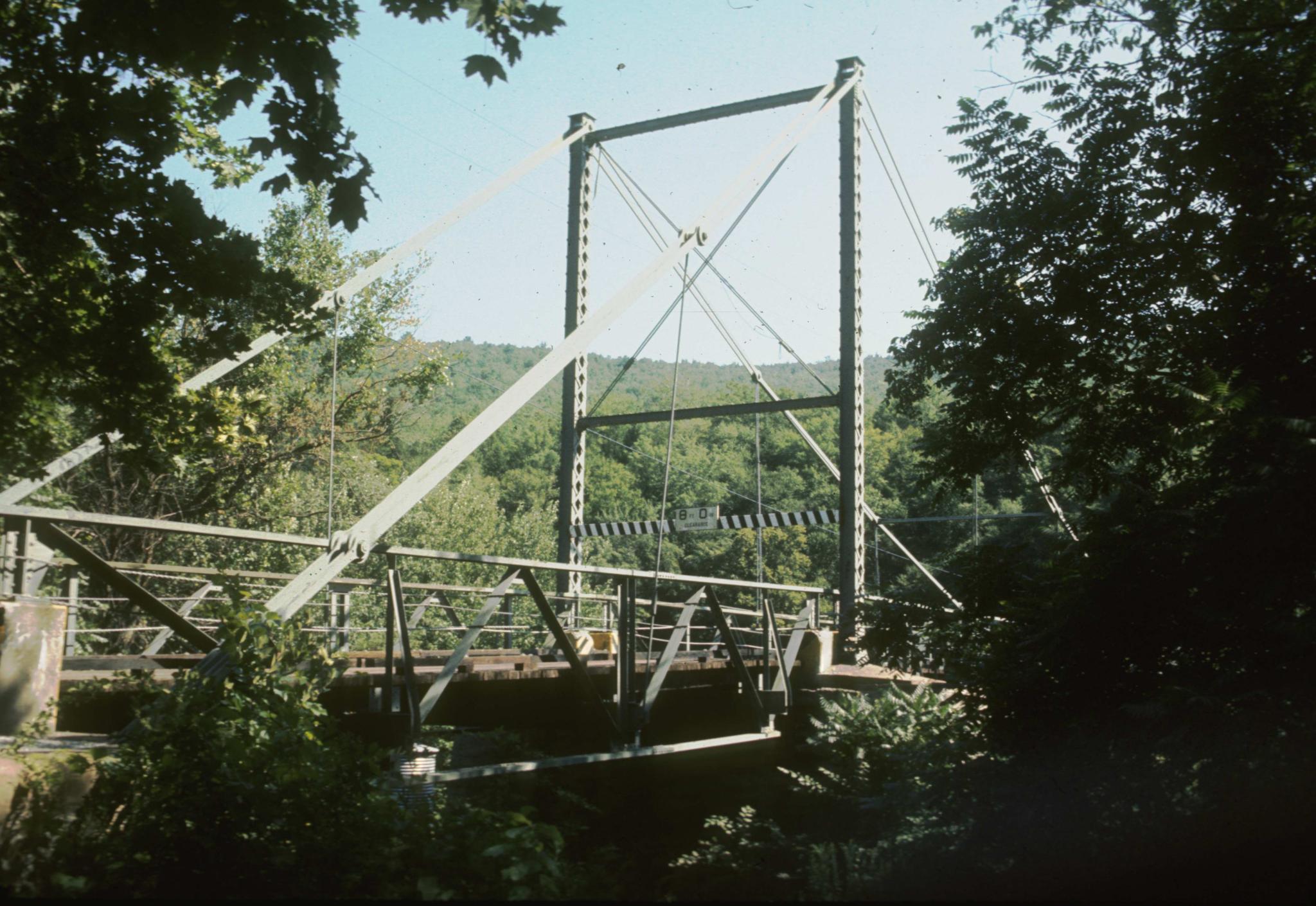 Photograph of the Lordville suspension bridge.  The bridge crosses the Delaware…