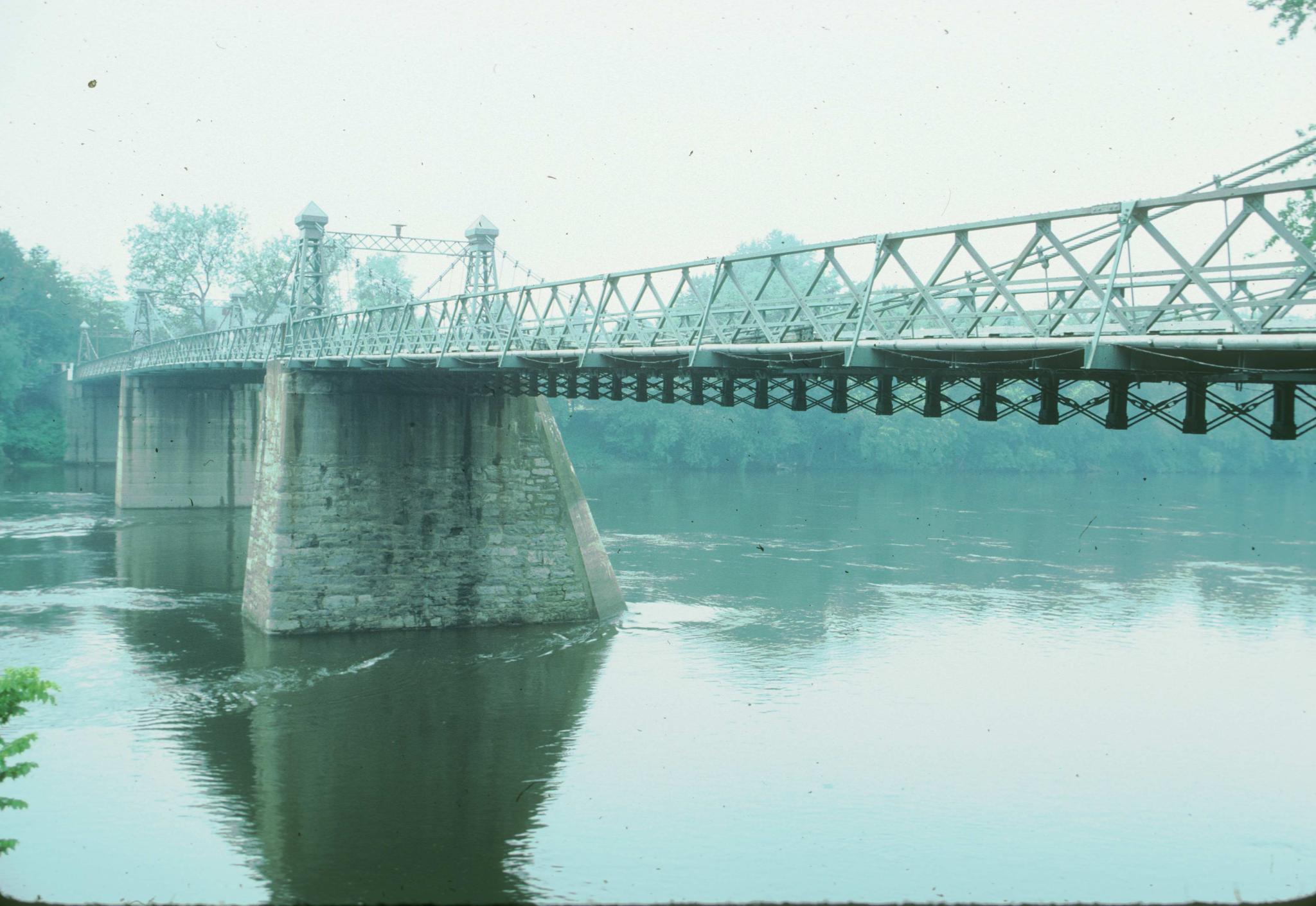 A photograph of the Riegelsville bridge showing the deck and two of the piers.