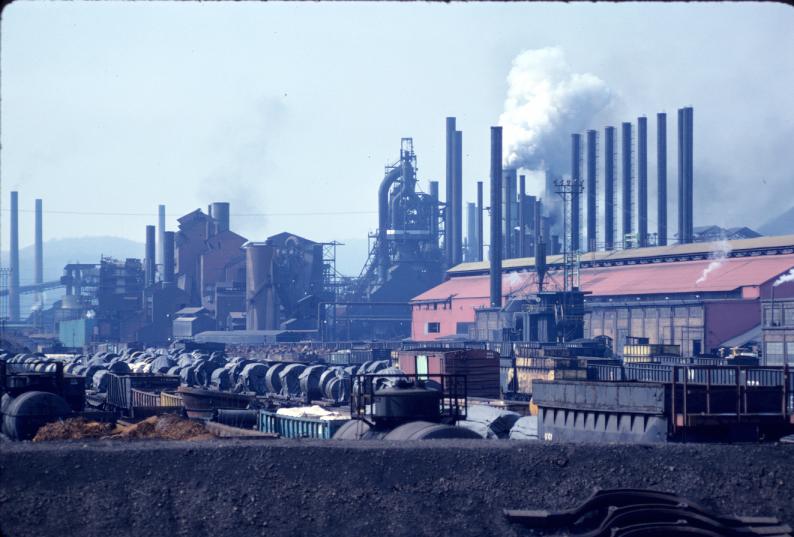 Photograph of the Weirton Steel Company mill in West Virginia.  Rolls of steel…