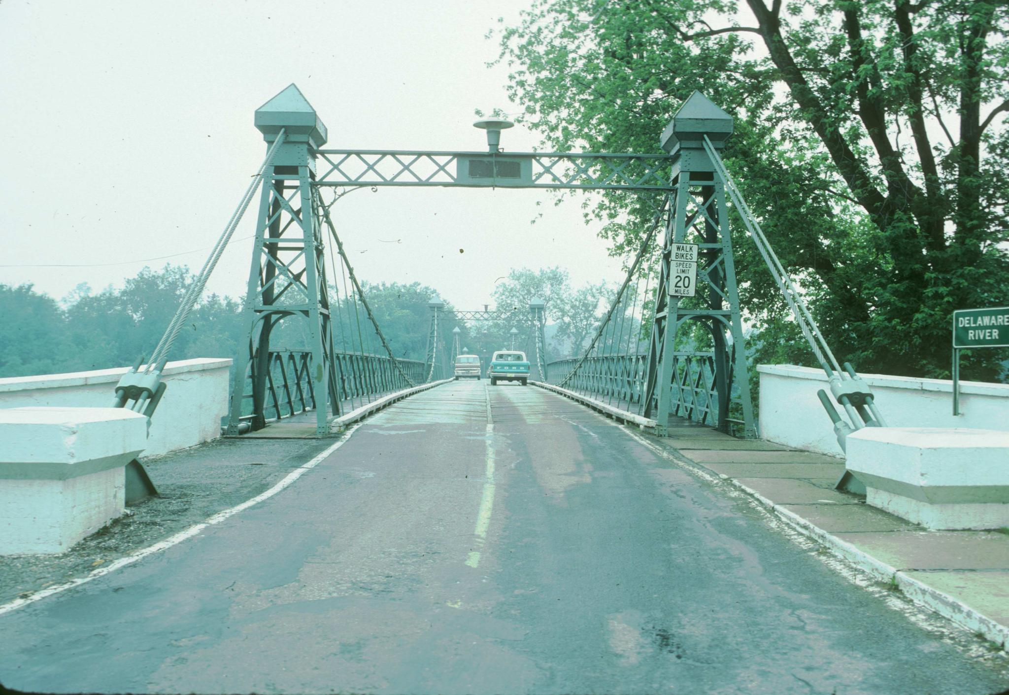 Photograph along the deck of the Riegelsville bridge showing one of the support…