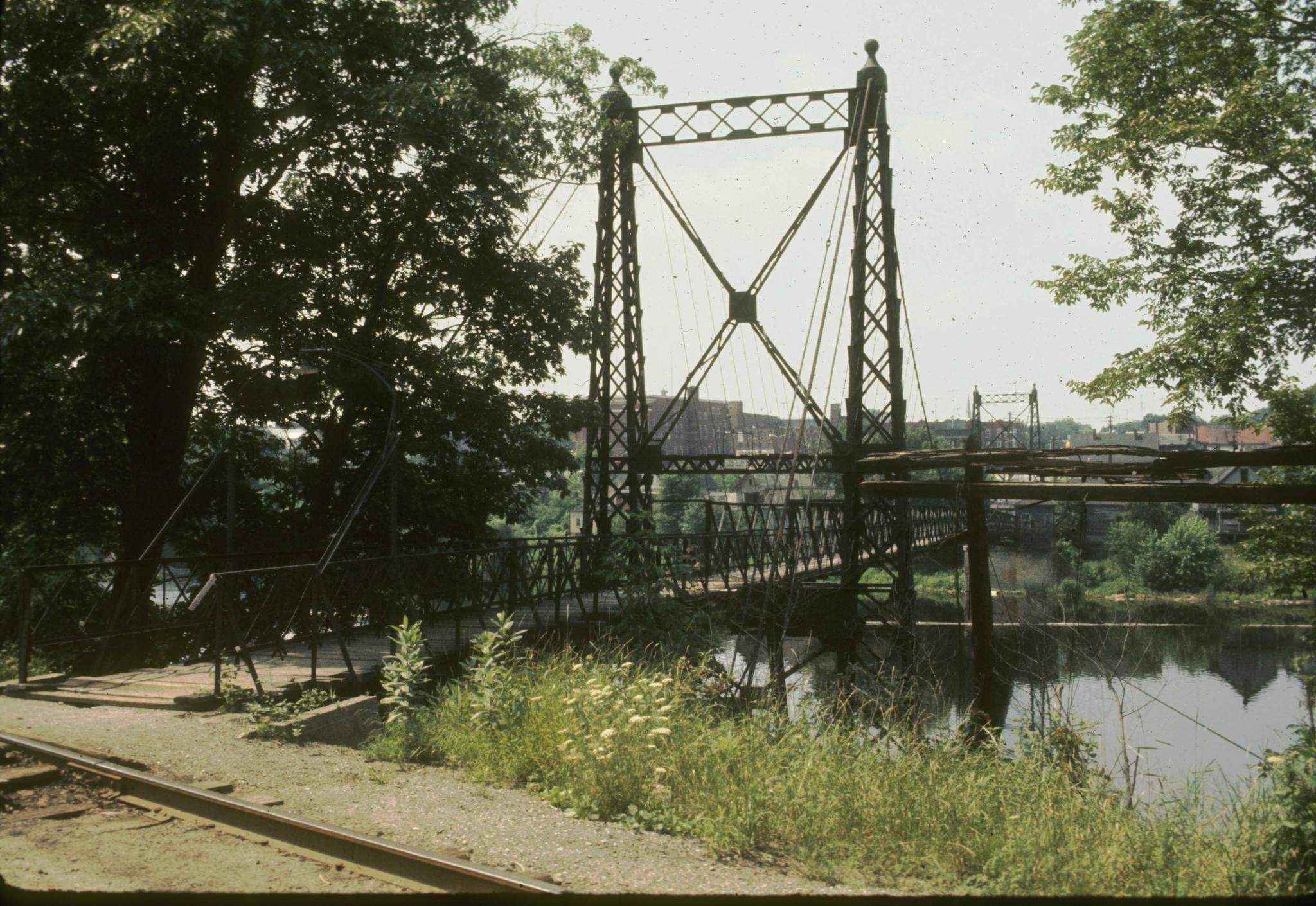 Photograph of the Ticonic foot bridge focusing on one of the support towers.