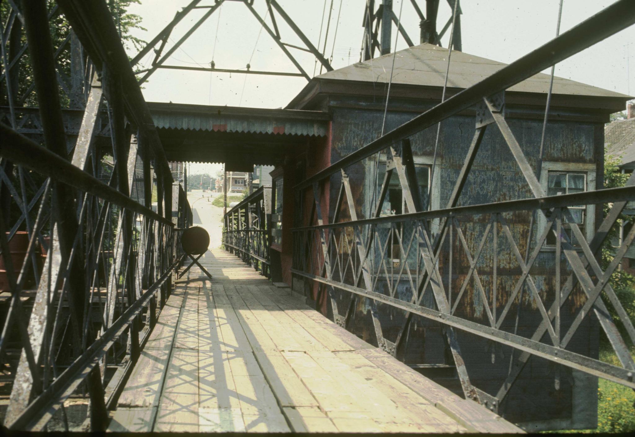 Photograph of the toll-house of the Ticonic foot bridge taken from the bridge…