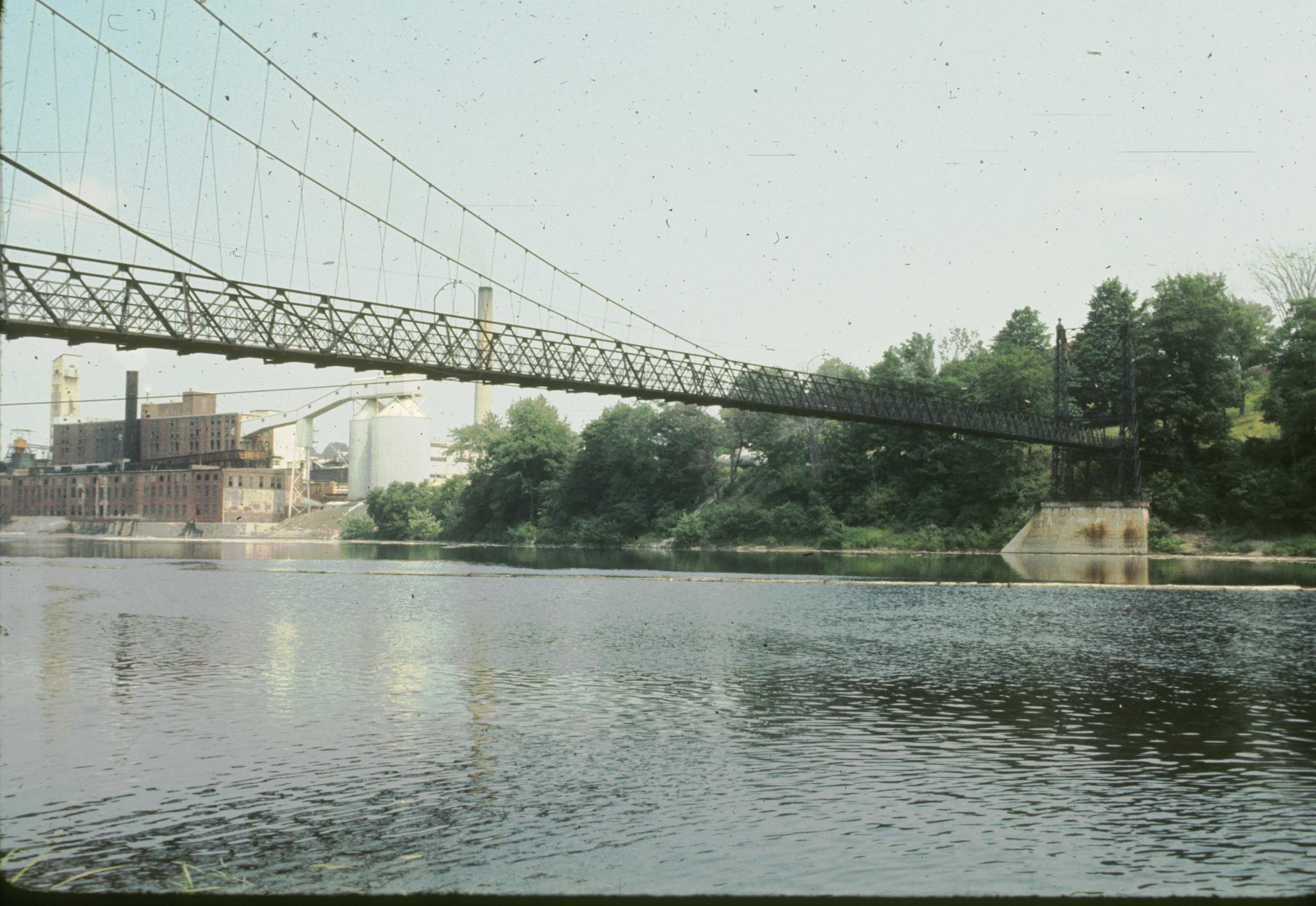 Three-quarter view of the Ticonic foot bridge taken from the river bank.…