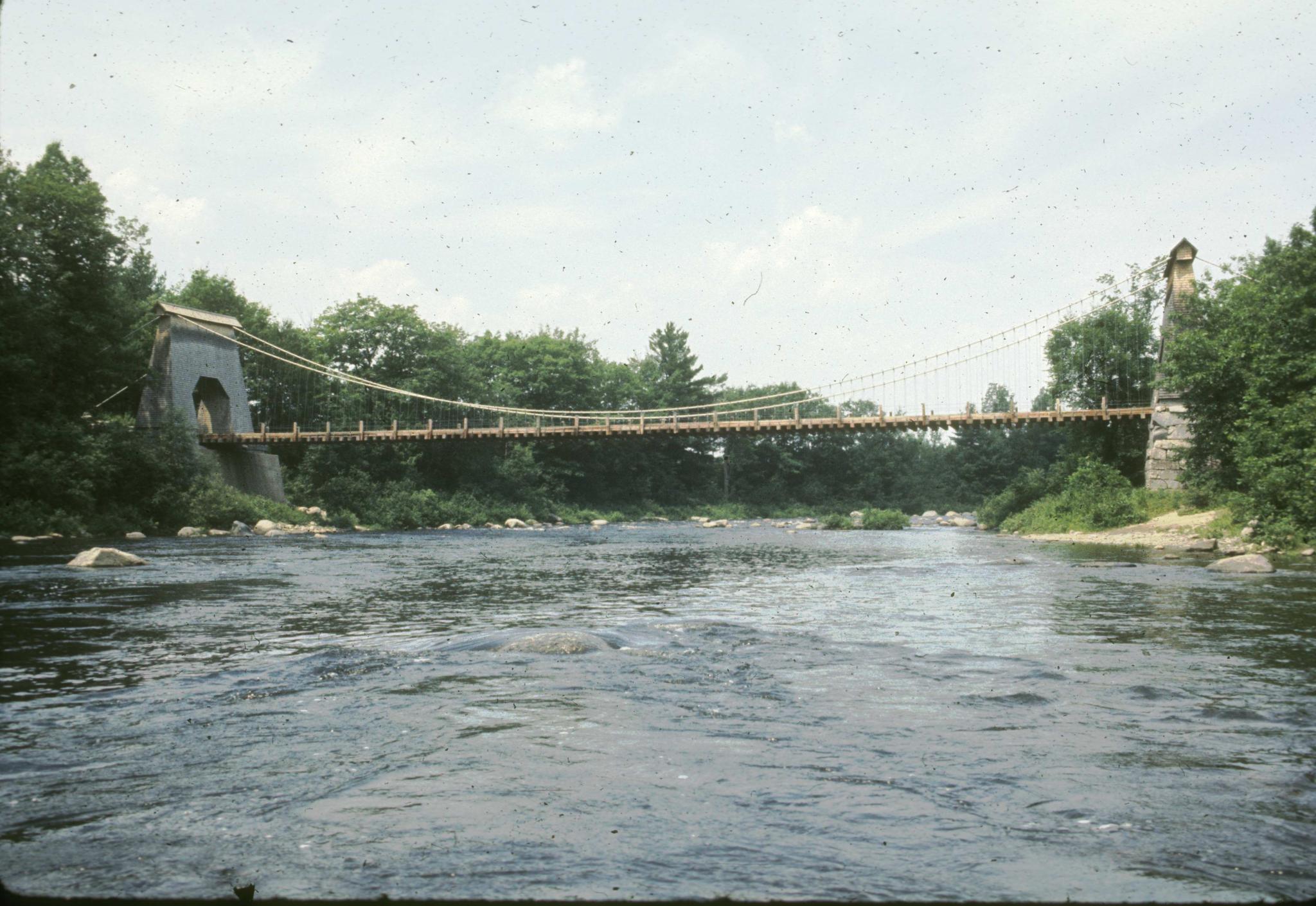 Side view of the wire bridge at New Portland taken from the river.