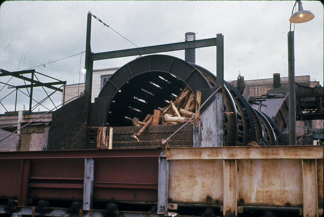 View of a debarking drum at the Chandler saw mill, Quebec.