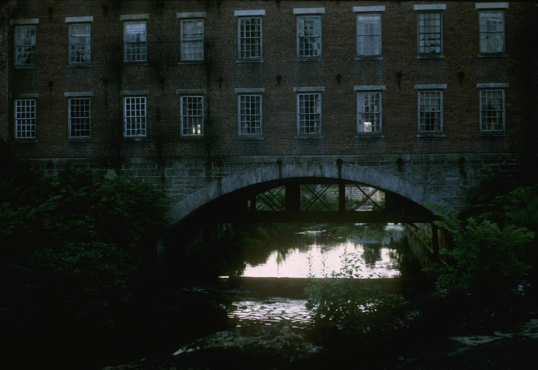 Photograph of the central brick connecting structure of the mill focusing on…