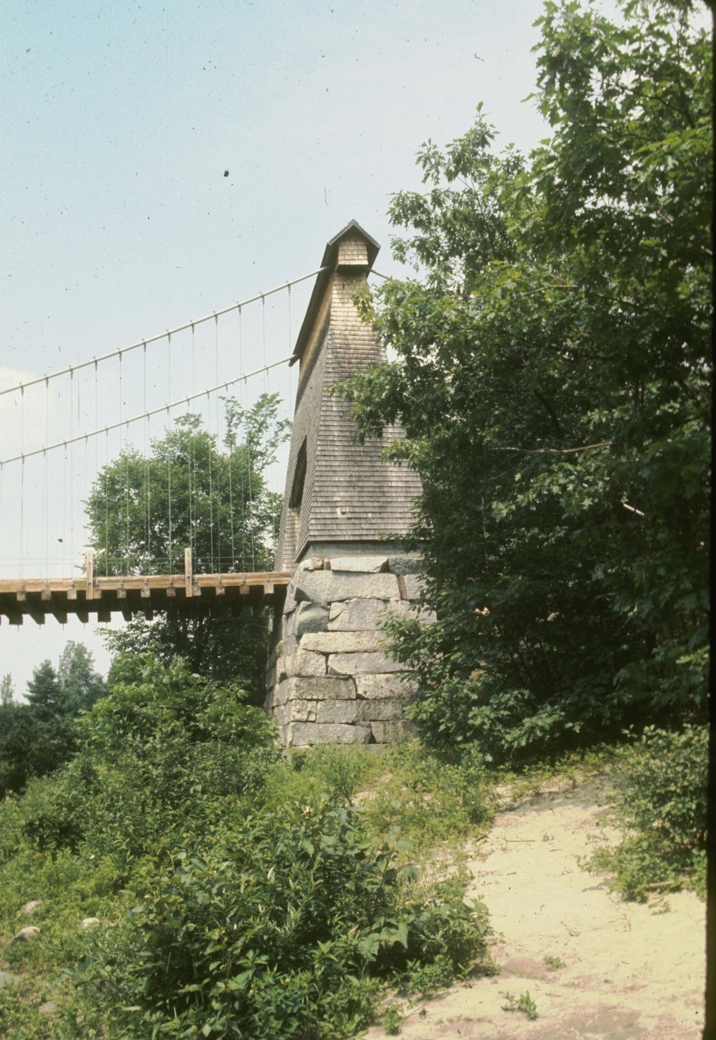 Side view of one of the support towers of the bridge showing the rough masonry…