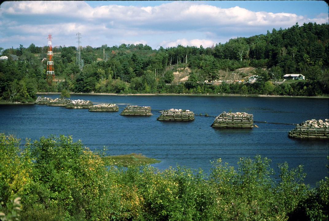 View of log boom piers in the Kennebec River South of Hallowell, ME.