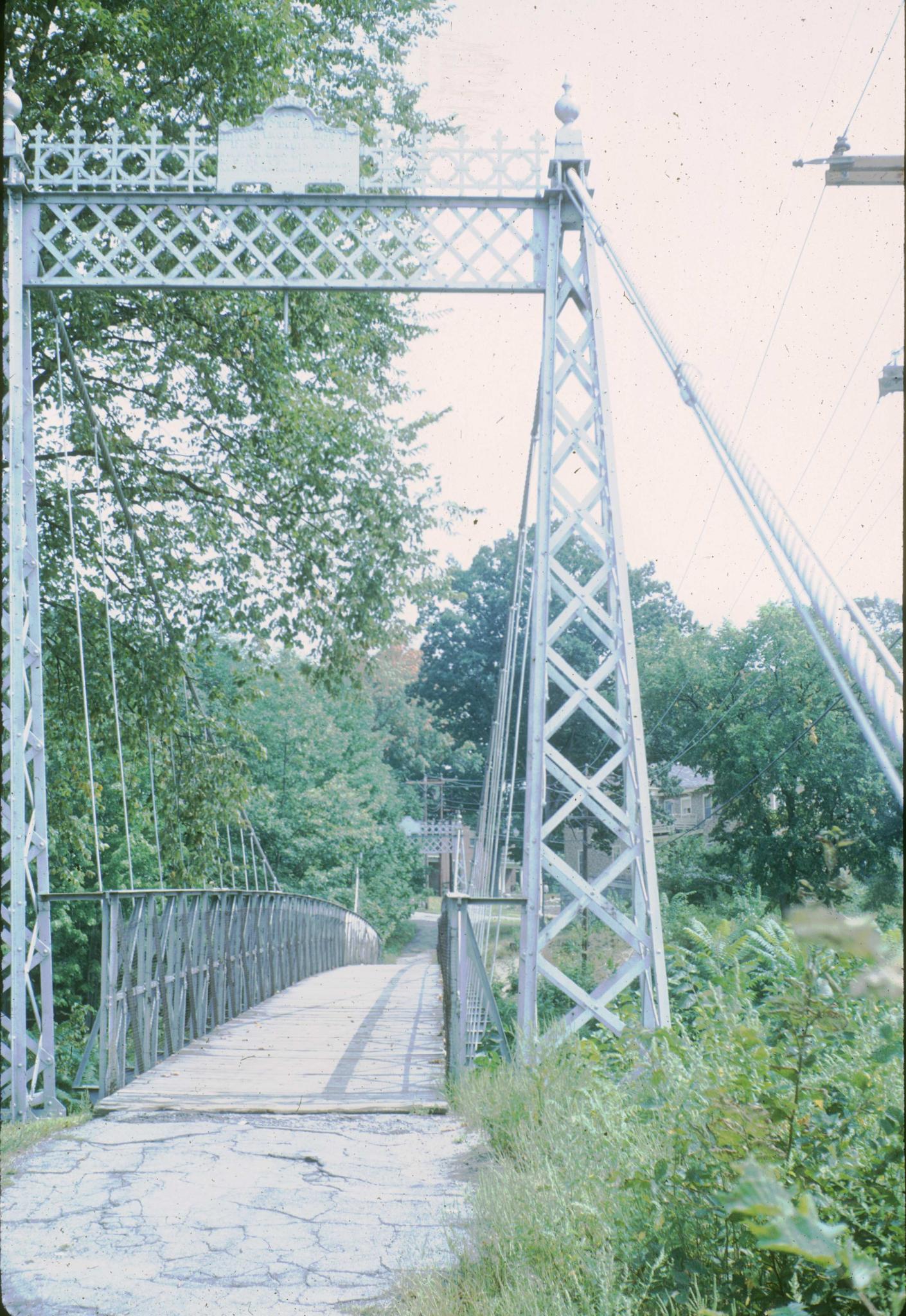 Photograph down the deck of the Milford suspension bridge showing good detail…