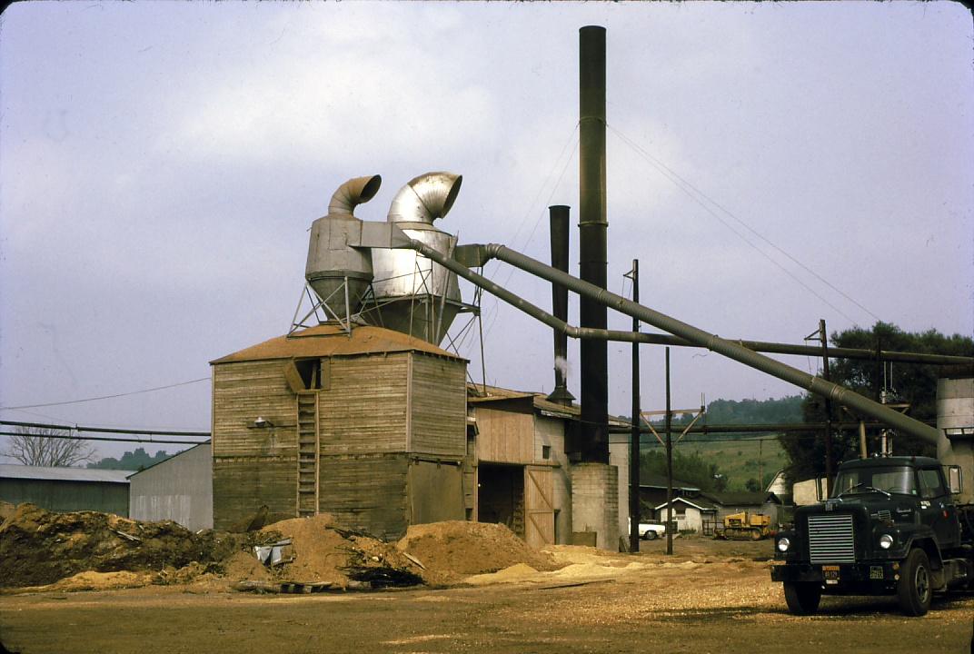 View of steam powered saw mill south of Syracuse, NY.  Stacks visible.  