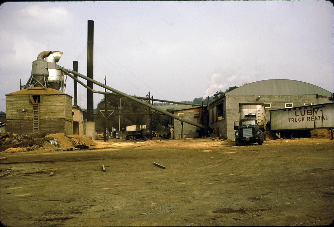 View of steam powered saw mill south of Syracuse, NY.  Stacks visible.  