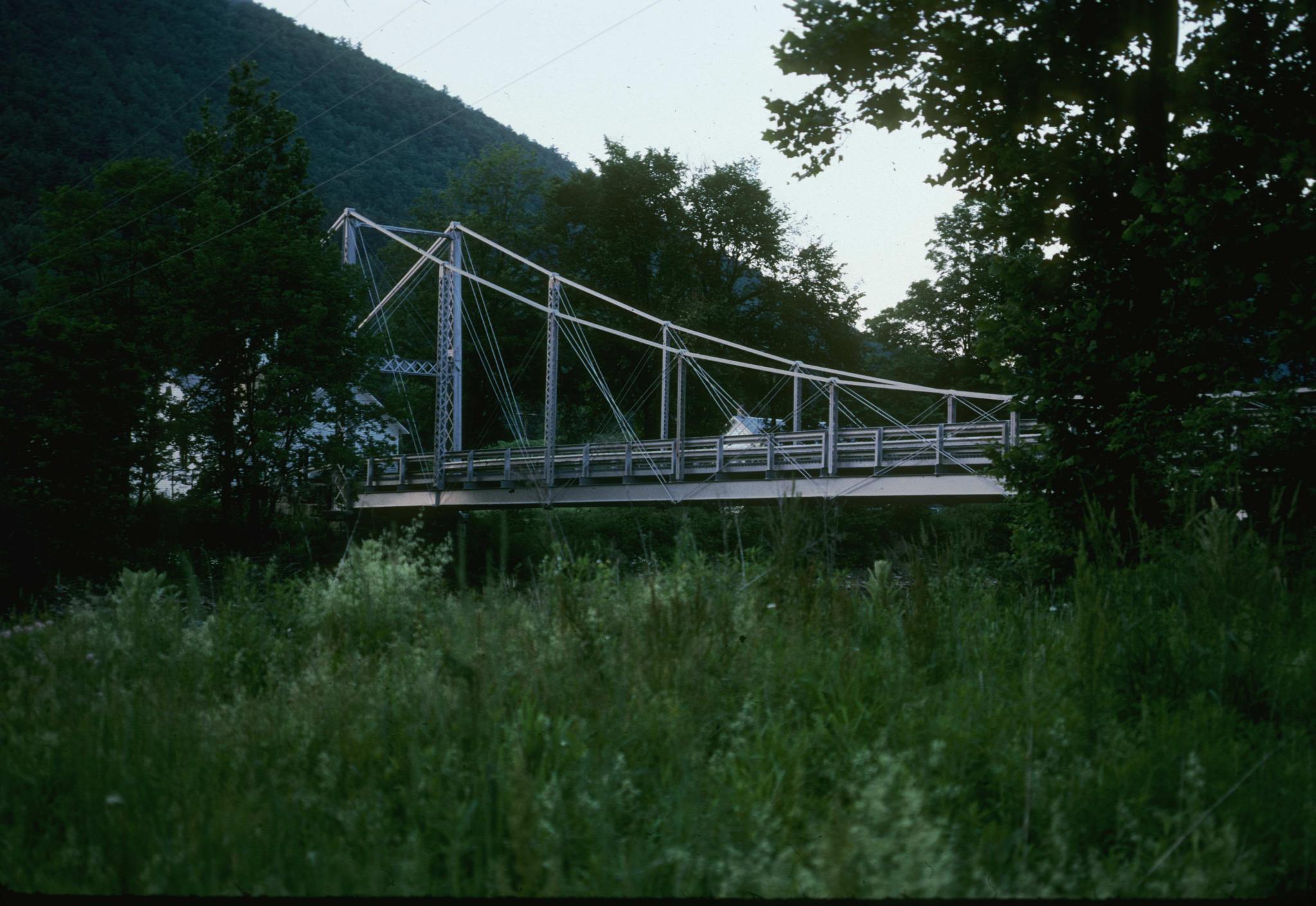 Photograph of the bridge showing a portion of the span and a support tower.