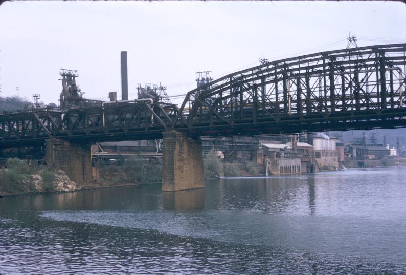 Photograph of hot metal bridge with J&L plant in background.  Photograph…