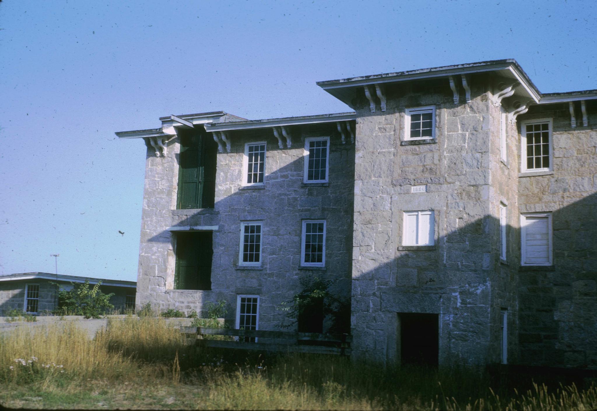 Photograph of the old mill showing loading doors.