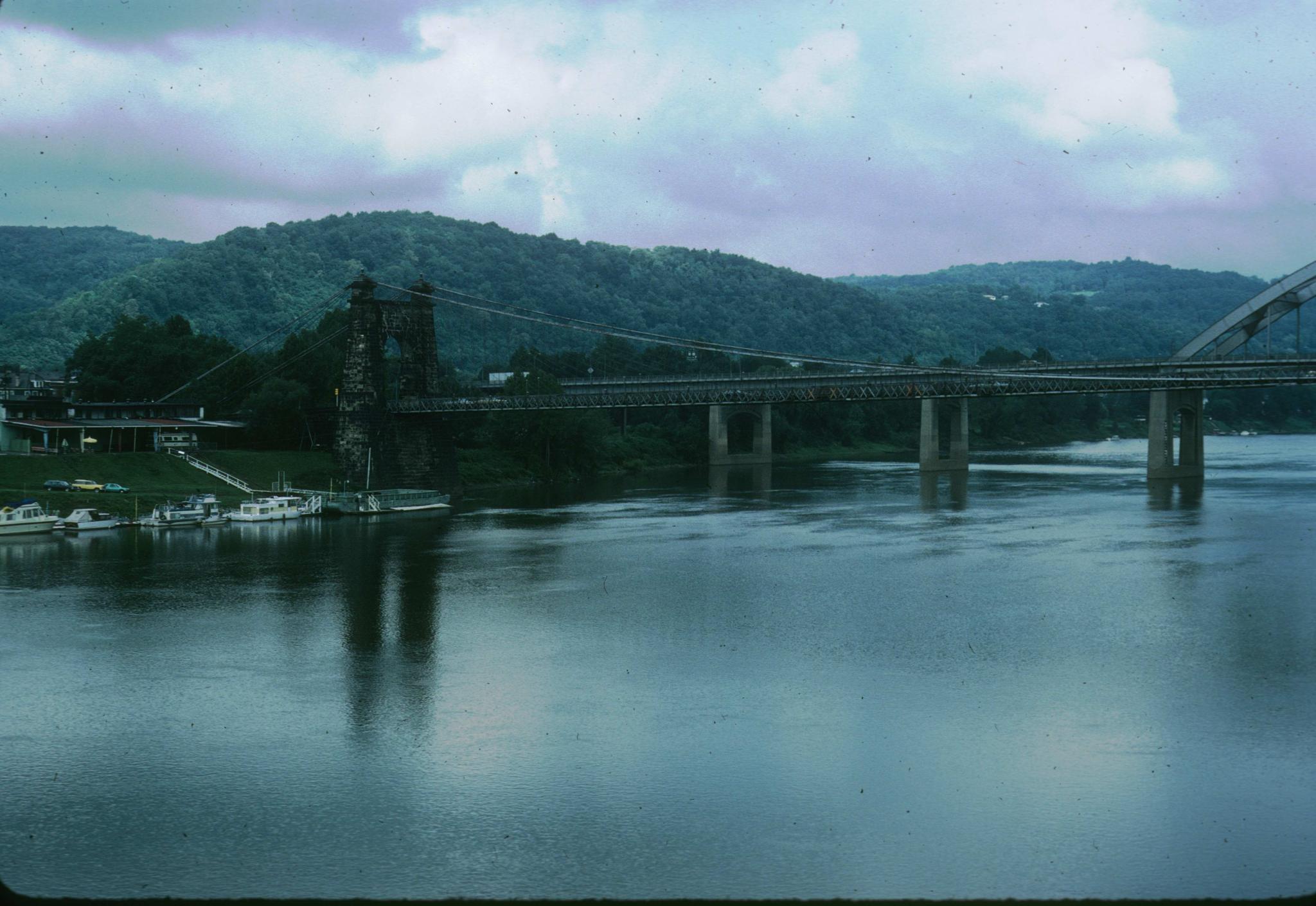 Photograph of the bridge looking southeast.  A small marina lies immediately…